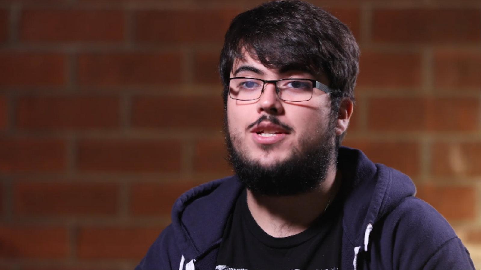 ZeRo speaking to camera with brick wall behind him