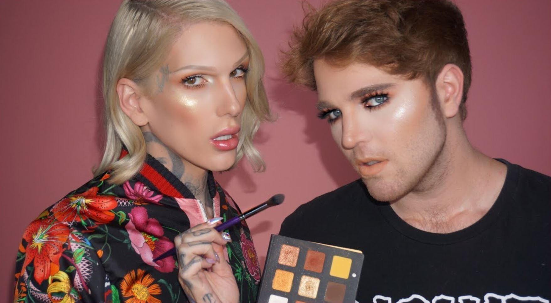 Shane Dawson and Jeffree Star hold up an eyeshadow palette.