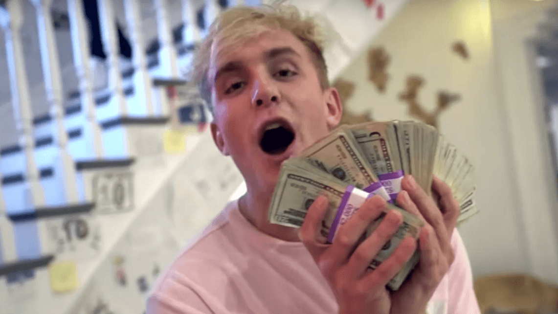 Jake Paul holding money