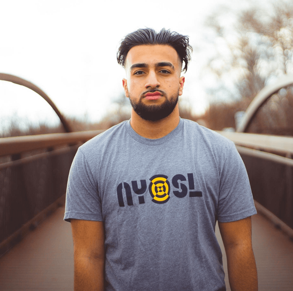 Asim wearing NYSL merch