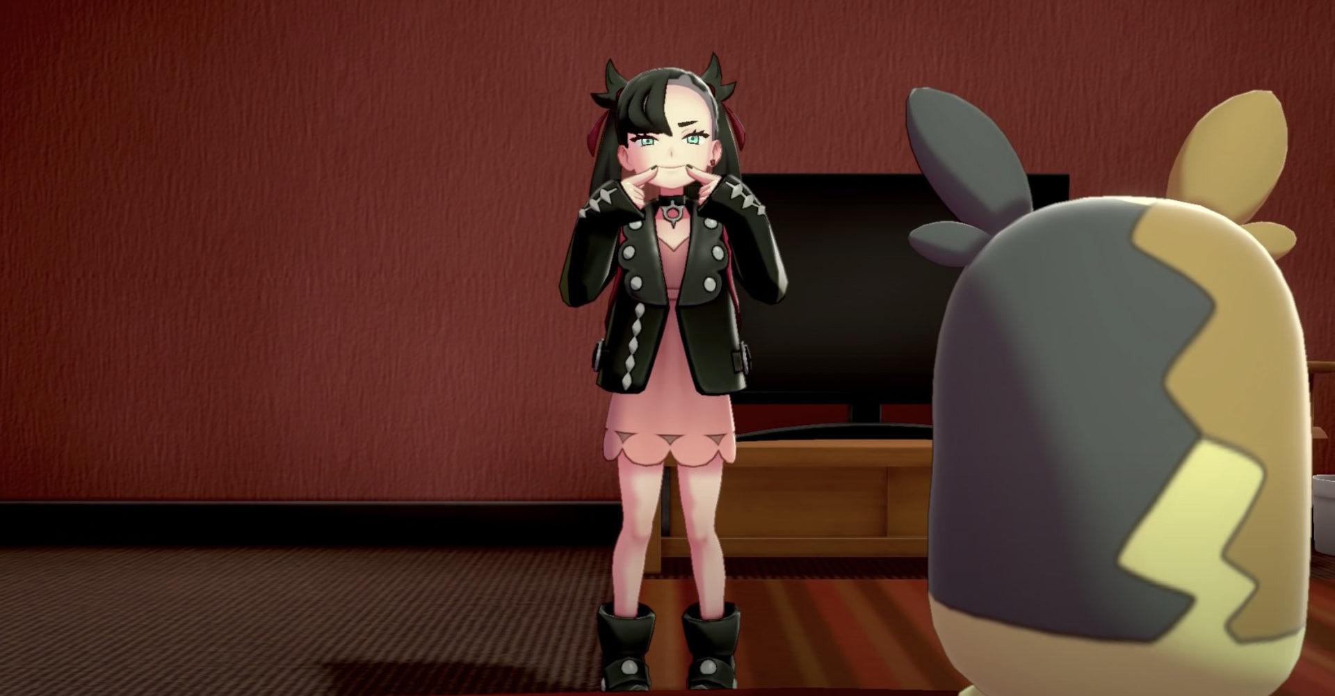 Screenshot of Marnie in Pokemon Sword & Shield smiling.