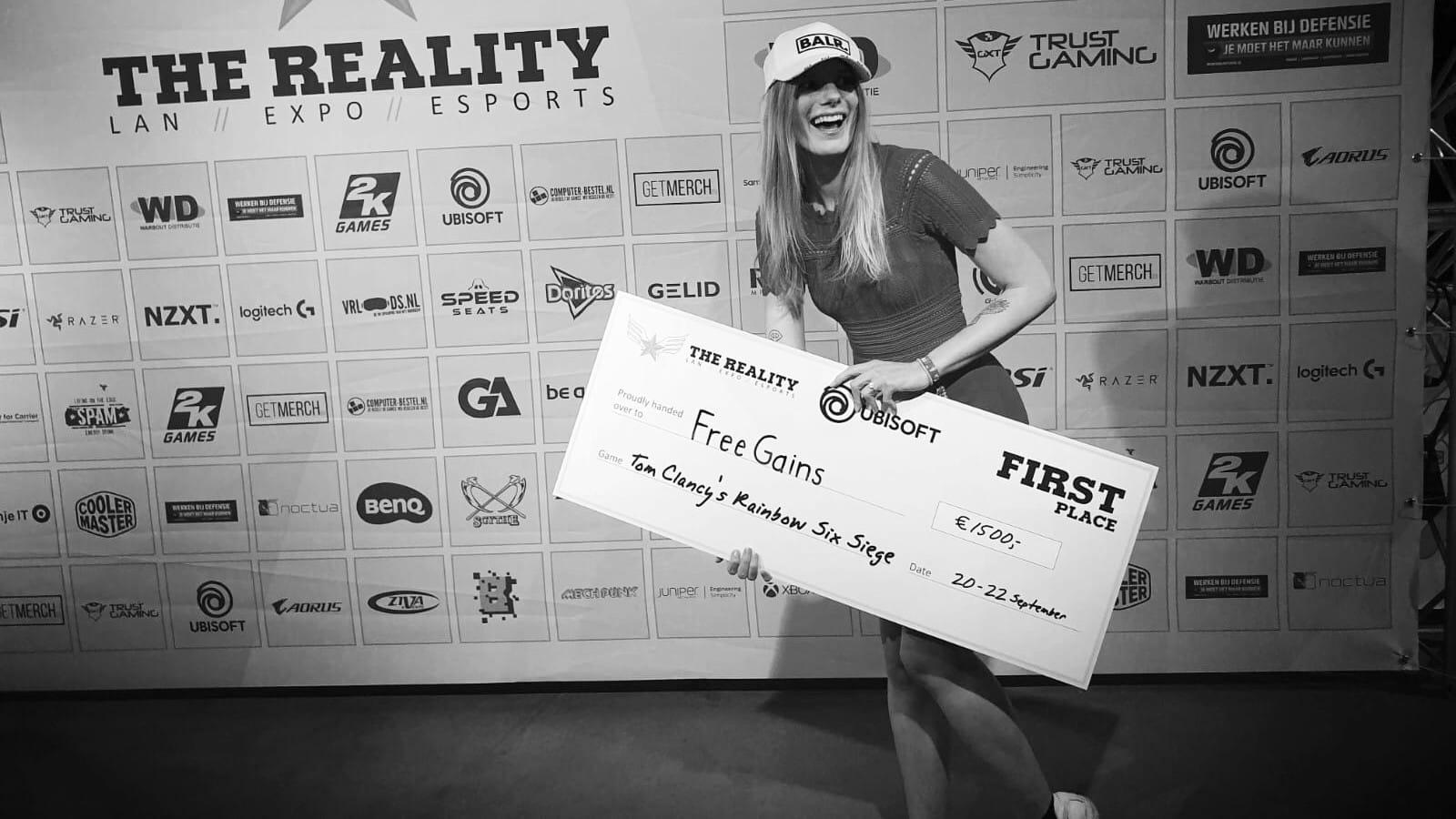 R6 player MissMarie with novelty cheque after winning The Reality LAN event