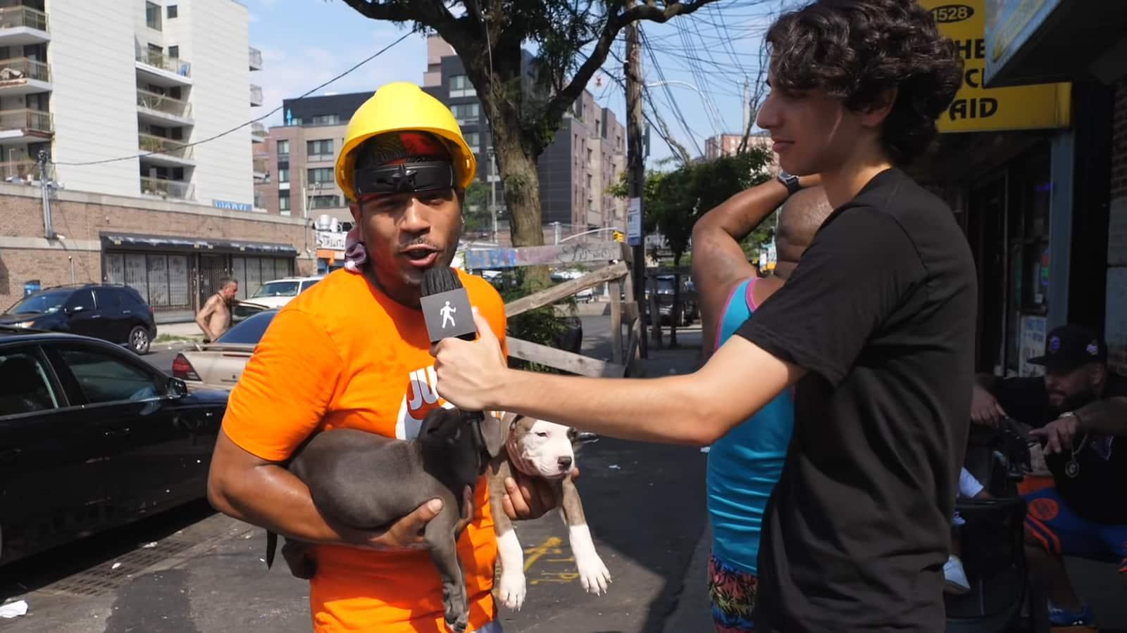 Sidetalk Coney Island hardhat guy holding dogs