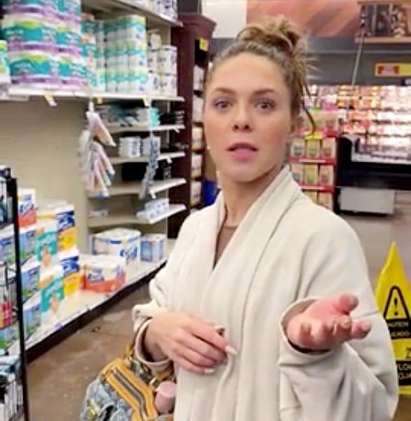 Woman stands in a grocery store