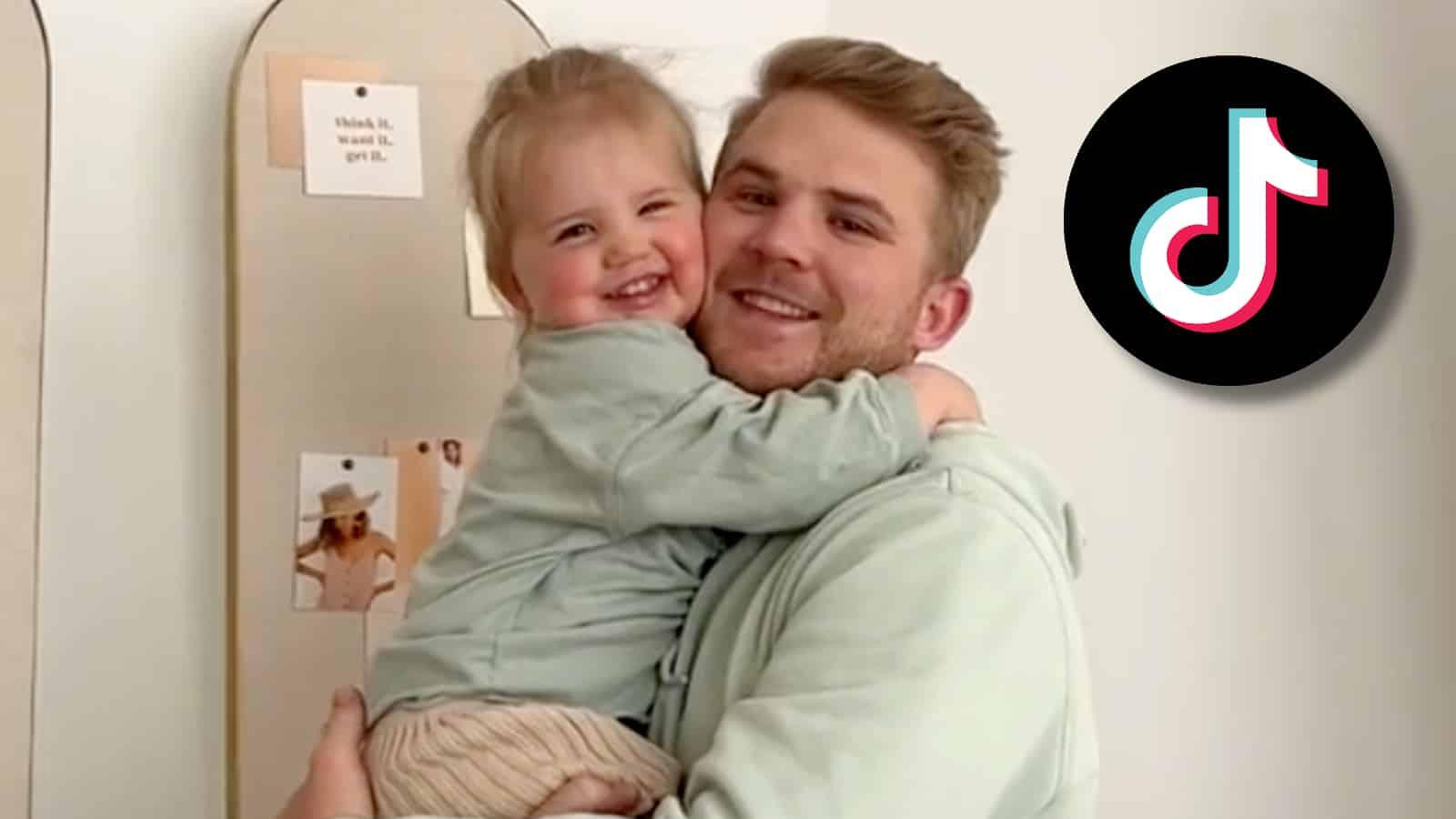 Man holding a child next to TikTok logo