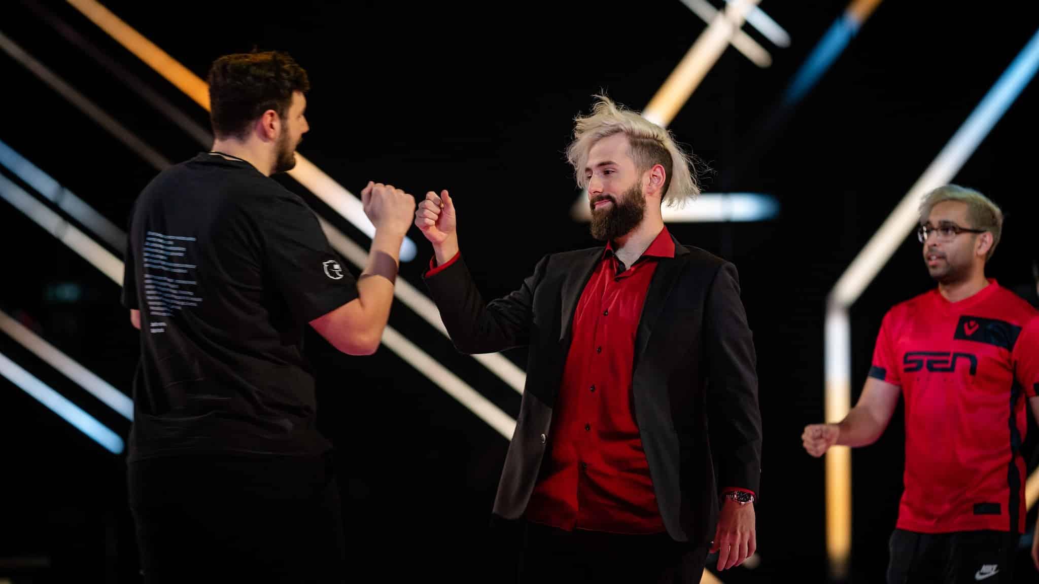 Rawkus fist bumps a fellow competitor on the Valorant Masters stage.