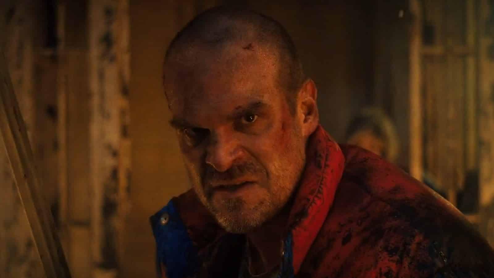 David Harbour as Hopper holding a sword in Stranger Things Season 4