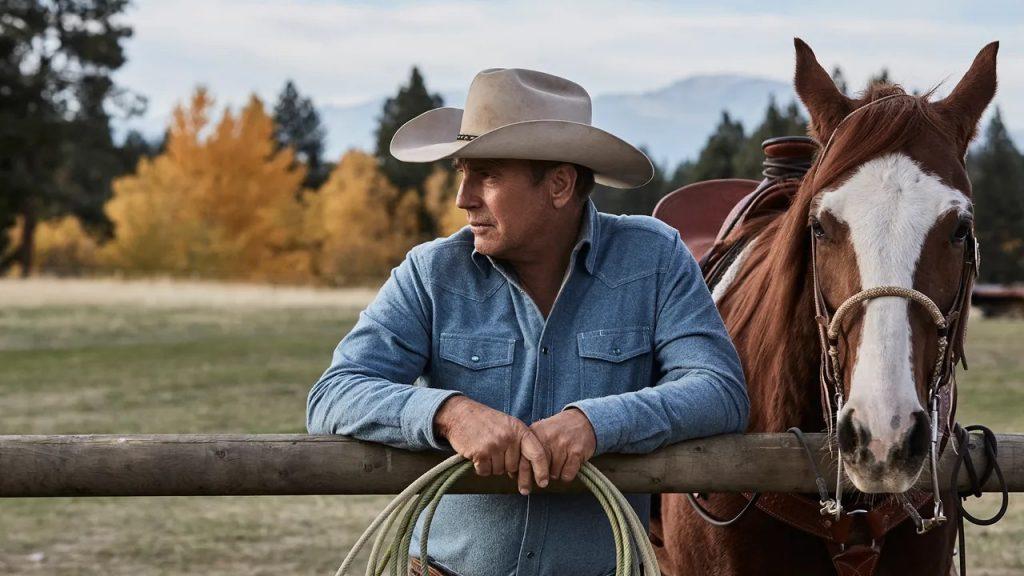 Kevin Costner as John Dutton with a horse in Yellowstone