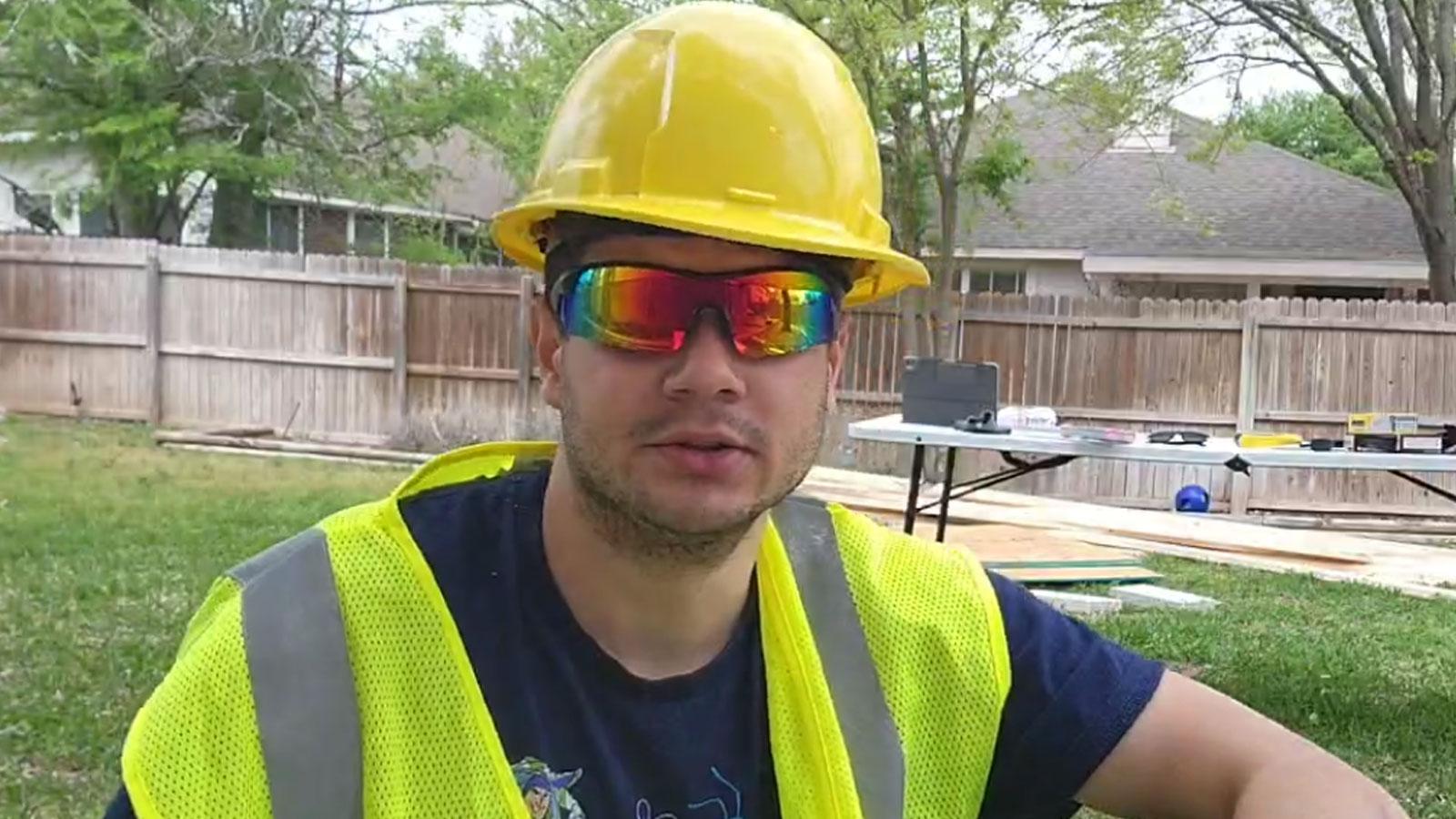 Erobb wearing protective helmet and hi viz jacket