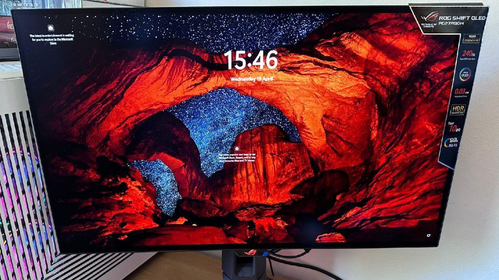 ASUS ROG PG27AQDM on the windows splash screen showcasing the display at night