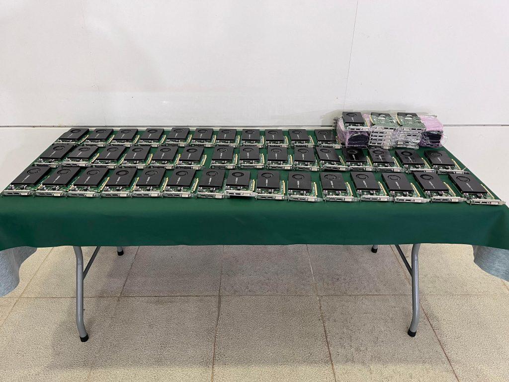 A table full of seized graphics cards