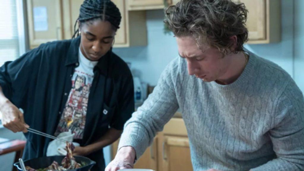 Carmy and Syd cooking in the kitchen in The Bear