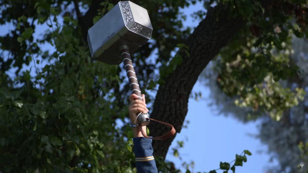 kid lifting Thor's Hammer in mtg Marvel trailer