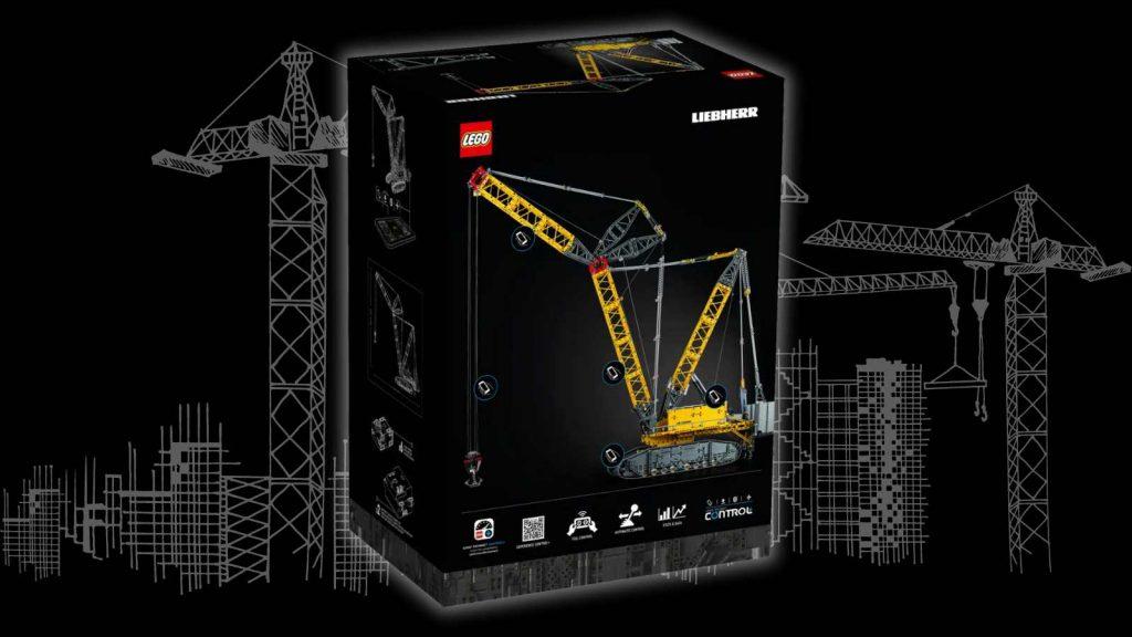 The LEGO Technic Liebherr Crawler Crane on a black background with a construction graphic