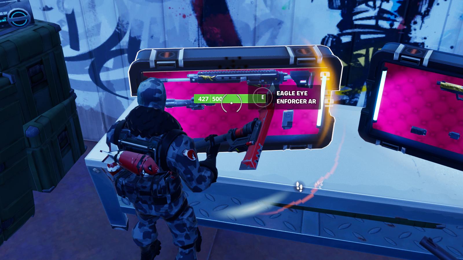 Fortnite player searching a Weapon Case during a match.