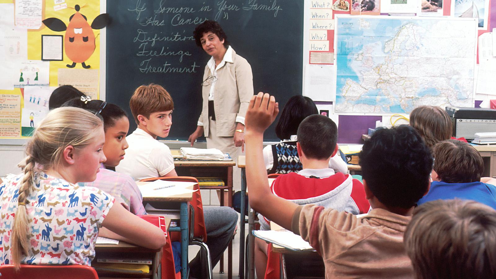 Unsplash teacher in front of class