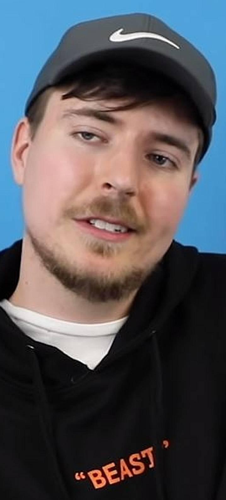 Screenshot of MrBeast sat down being interviewed by Oompaville in YouTube video.