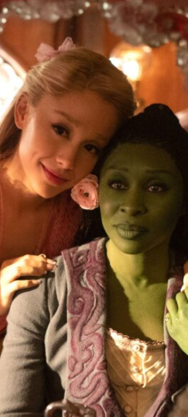 Elphaba and Glinda look over a toy version of Oz in Wicked movie