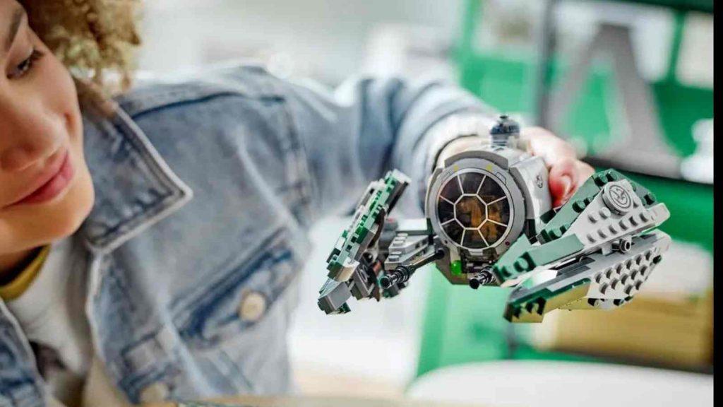 A child playing with their LEGO Star Wars Yoda's Jedi Starfighter