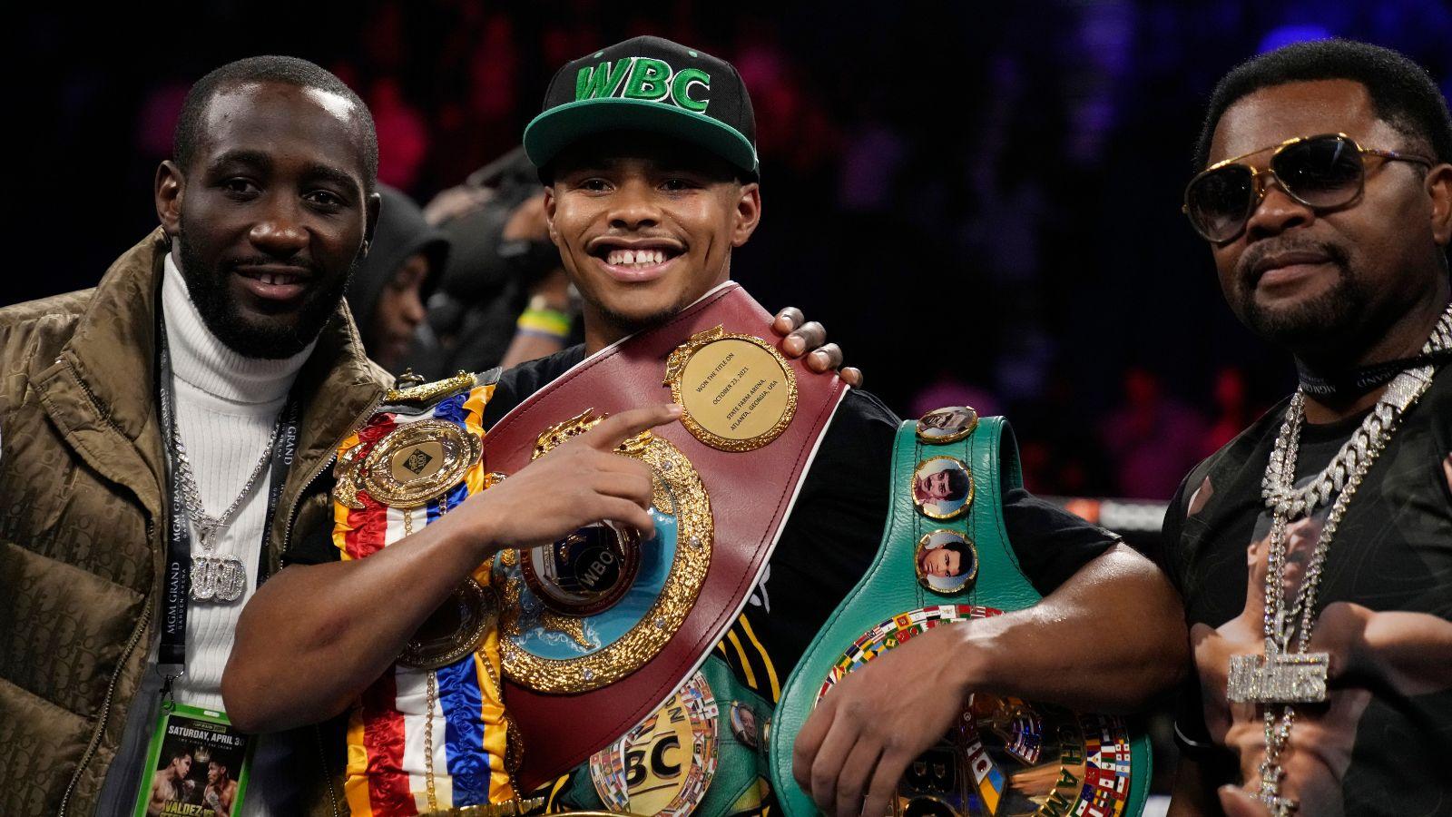 Shakur Stevenson (center) in the boxing ring.