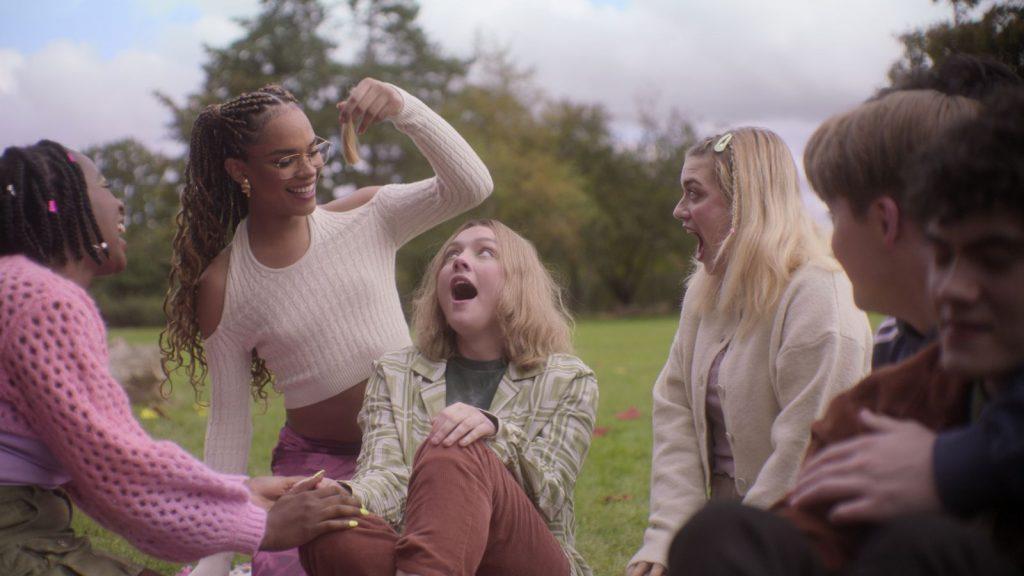 The Heartstopper cast good around in a park