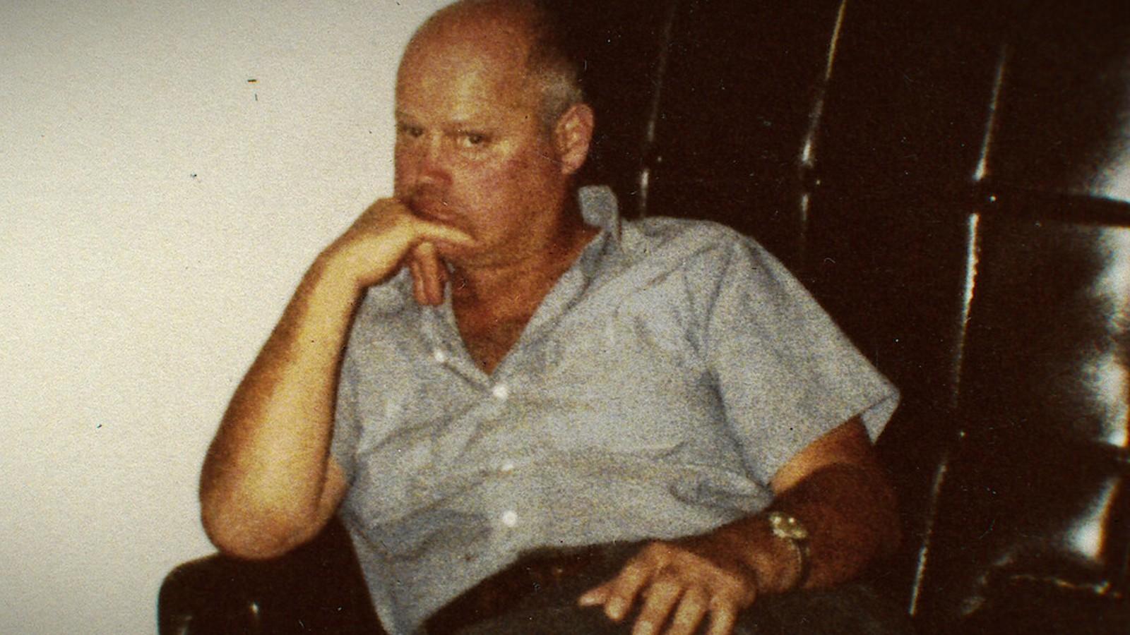 Zodiac suspect Arthur Leigh Allen sitting in a leather chair.