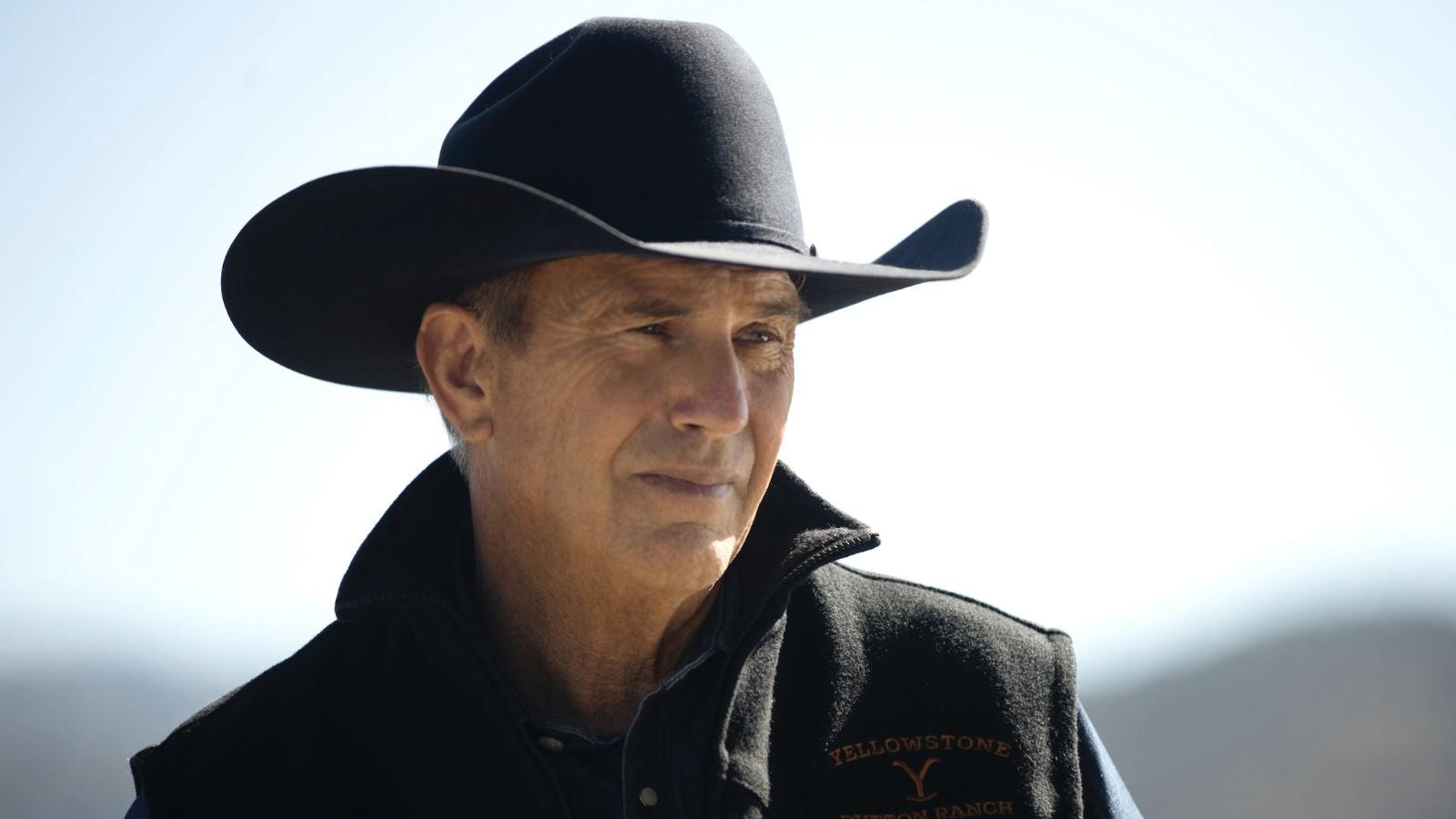 Is Yellowstone based on a true story? Kevin Costner as John Dutton wearing a cowboy hat