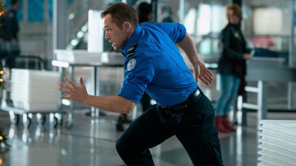 Taron Egerton sprinting in Carry-On.