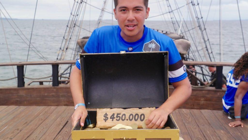 Man in front of $450k Beast Games